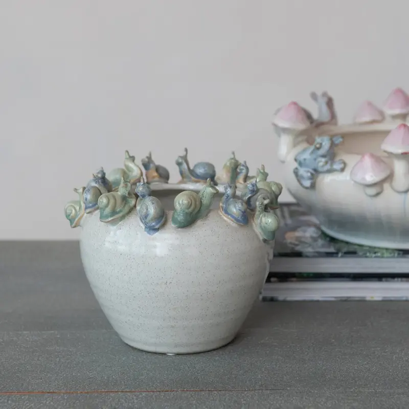 Rim-Decorated Stoneware Planter With Ceramic Snail Accents 1