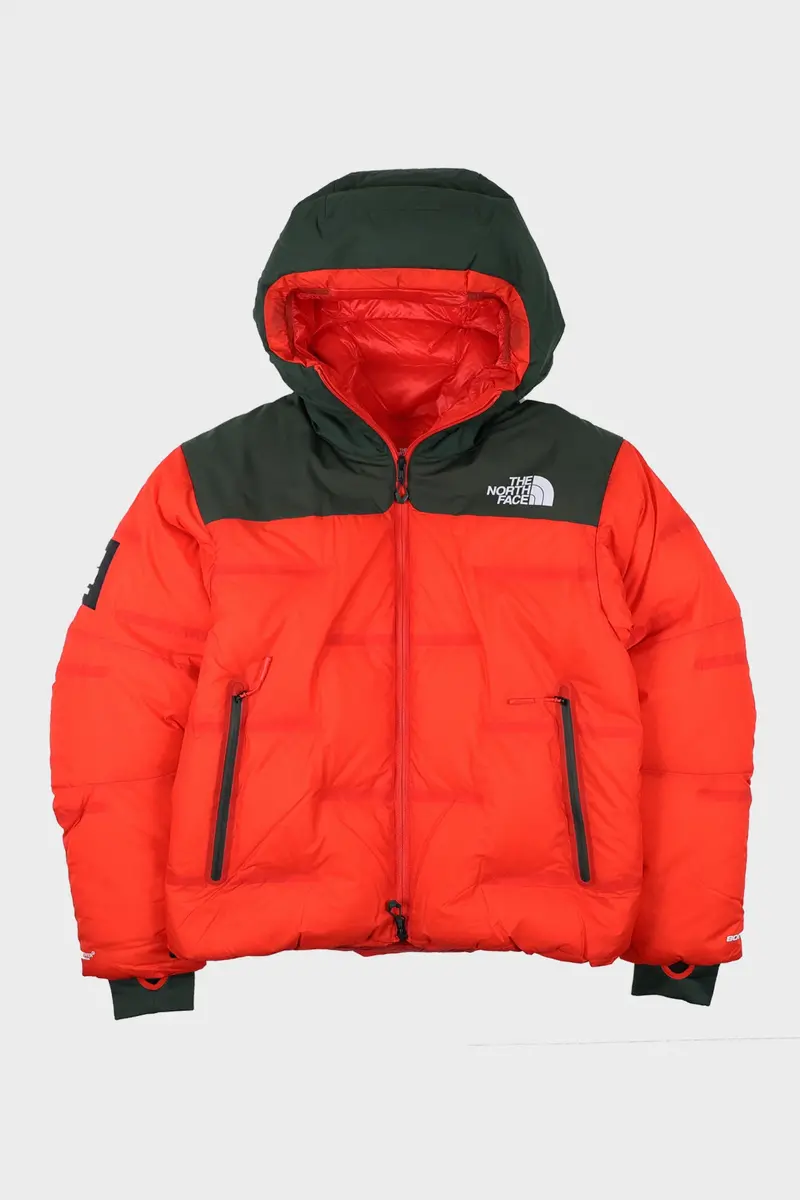 The North Face X Undercover Soukuu Nuptse Jacket – Dark Cedar Green & High Risk Red 1